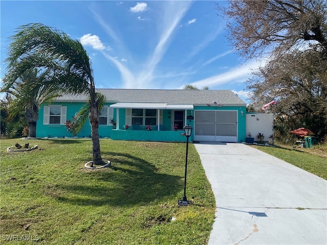 single story home with a front yard and a garage