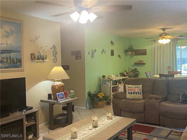 tiled living room with a textured ceiling and ceiling fan