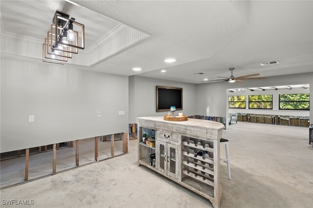 interior space featuring ceiling fan and concrete flooring