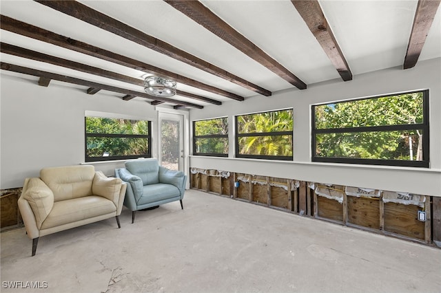 435 Donora Blvd, Fort Myers Beach, FL 33931 - sunroom with plenty of natural light, a ceiling fan, beam ceiling, and unfinished concrete flooring