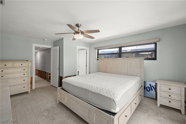 bedroom with ceiling fan and light wood-type flooring