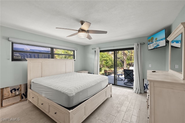 435 Donora Blvd, Fort Myers Beach, FL 33931 - bedroom with a ceiling fan, light wood-type flooring, a textured ceiling, and access to exterior