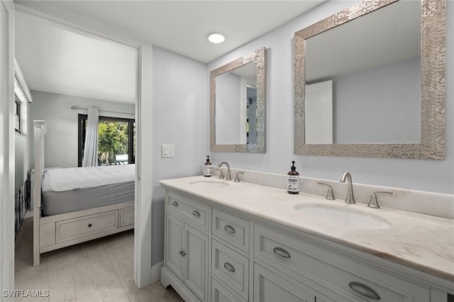 bathroom featuring vanity and hardwood / wood-style flooring