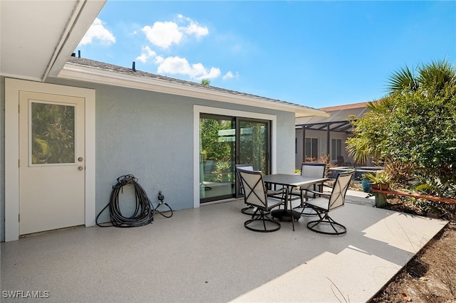 435 Donora Blvd, Fort Myers Beach, FL 33931 - view of patio / terrace with a lanai and outdoor dining area