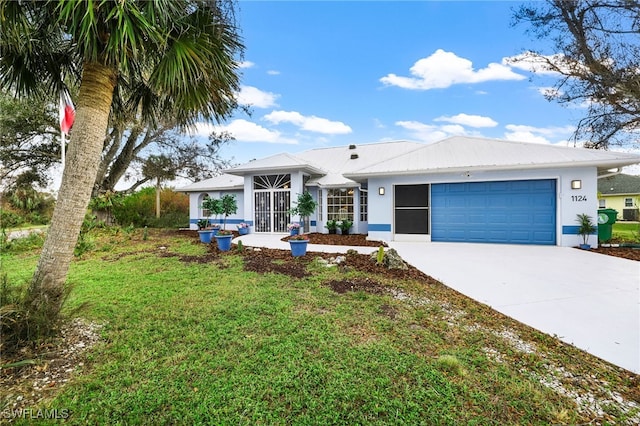 view of front facade with a front yard and a garage