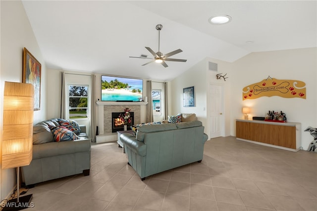 tiled living room featuring lofted ceiling and ceiling fan