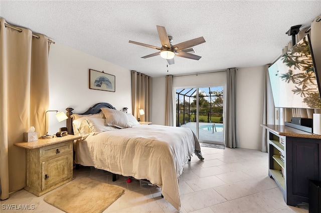 bedroom featuring a textured ceiling, access to exterior, and ceiling fan