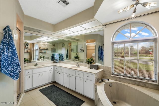 bathroom featuring vanity, independent shower and bath, and tile patterned flooring