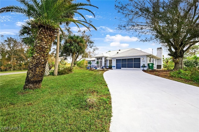 ranch-style home with a front lawn and a garage