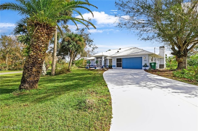 ranch-style home with a garage and a front lawn