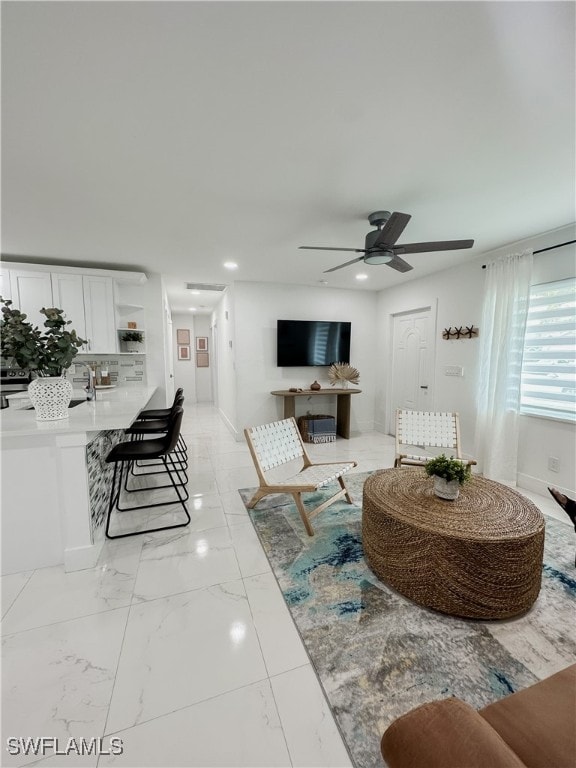 living room with ceiling fan