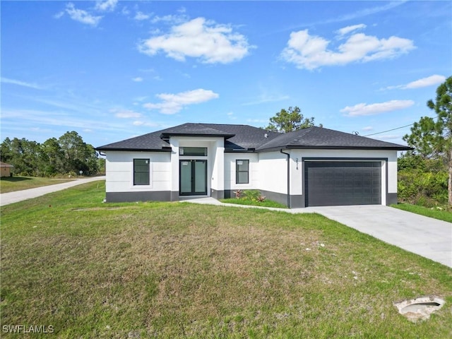 prairie-style house with an attached garage, driveway, a front lawn, and stucco siding