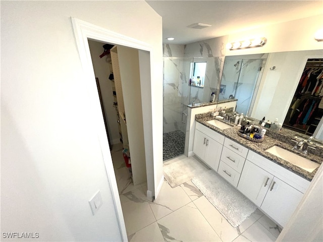 bathroom featuring vanity and an enclosed shower