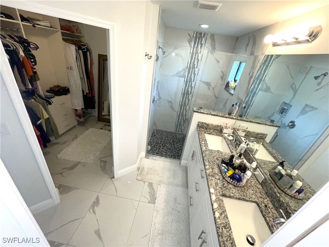 bathroom with vanity and walk in shower