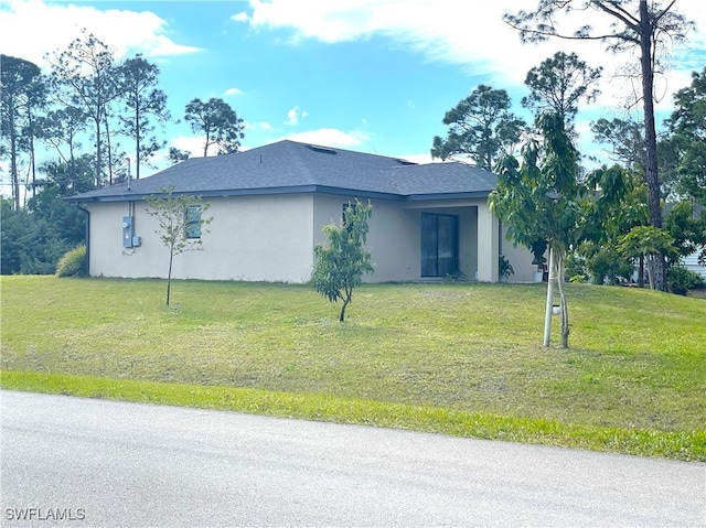 view of property exterior with a yard