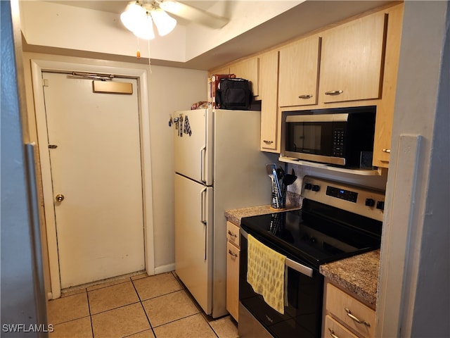 kitchen featuring light tile patterned floors, light brown cabinets, stainless steel appliances, and ceiling fan