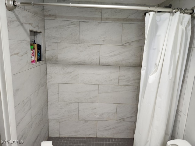 bathroom with a shower with shower curtain