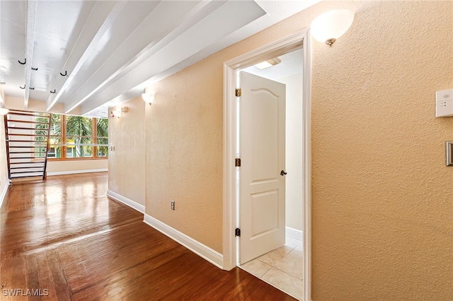 2260 First St Unit 207, Fort Myers, FL 33901 - corridor with a textured wall, baseboards, and wood finished floors