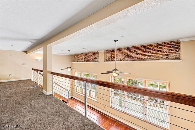2260 First St Unit 207, Fort Myers, FL 33901 - hall featuring baseboards, ornamental molding, brick wall, and carpet flooring