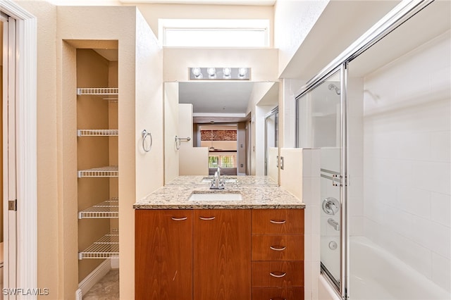2260 First St Unit 207, Fort Myers, FL 33901 - full bath with shower / bath combination with glass door, vanity, and healthy amount of natural light