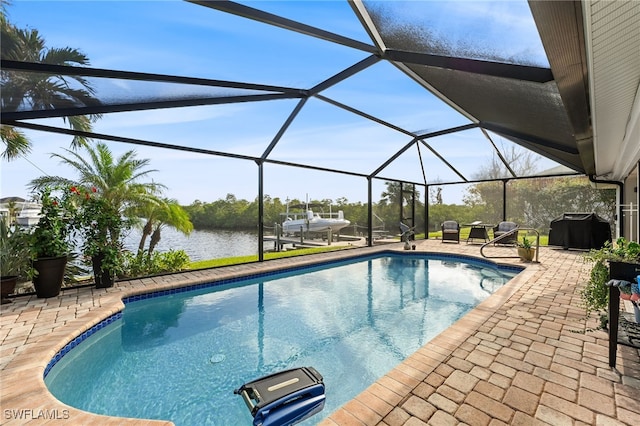 view of swimming pool featuring glass enclosure, a grill, a water view, and a patio