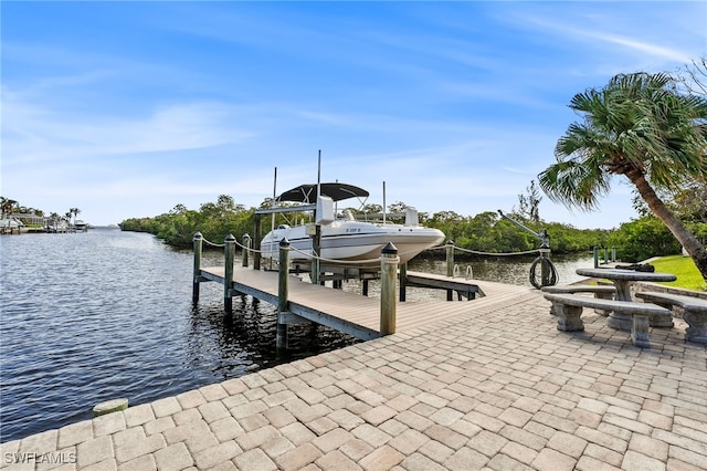 dock area featuring a water view and boat lift