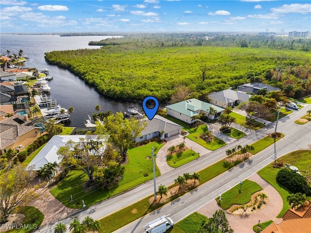 birds eye view of property with a water view