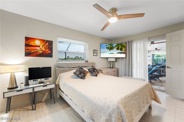 bedroom with access to exterior and ceiling fan