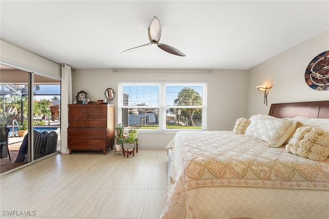 bedroom featuring access to exterior, multiple windows, and a ceiling fan