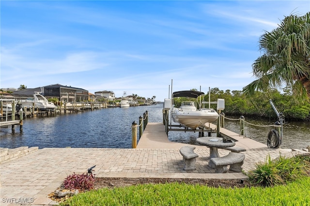 view of dock featuring a water view and boat lift