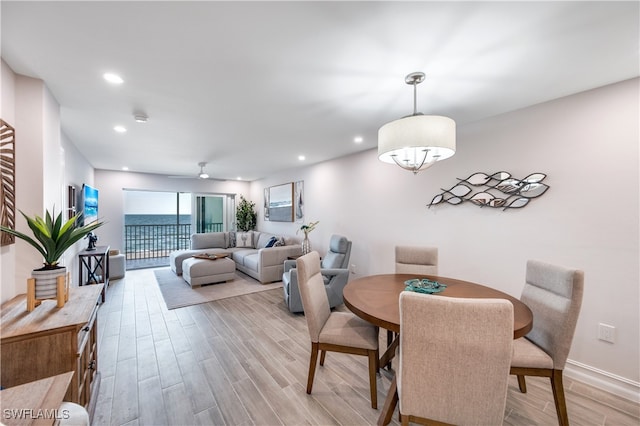 dining room featuring light hardwood / wood-style flooring and ceiling fan