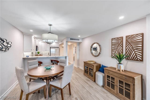 dining room featuring light hardwood / wood-style flooring