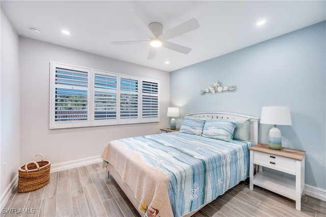 bedroom featuring ceiling fan and hardwood / wood-style flooring