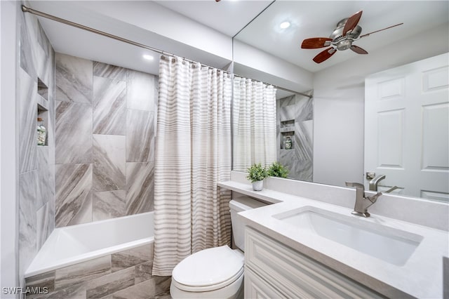 full bathroom with ceiling fan, shower / bath combo with shower curtain, vanity, and toilet