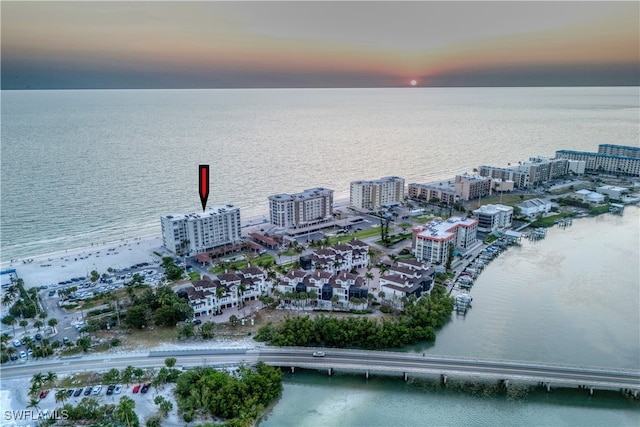 aerial view at dusk with a water view