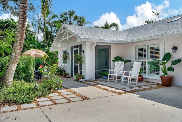 entrance to property with a patio area