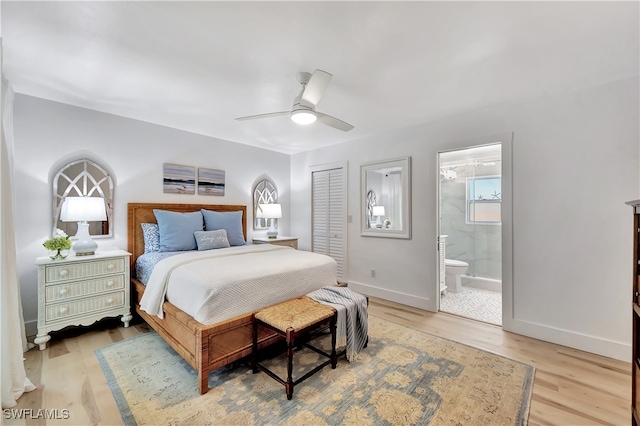 bedroom featuring a closet, ceiling fan, hardwood / wood-style flooring, and ensuite bath