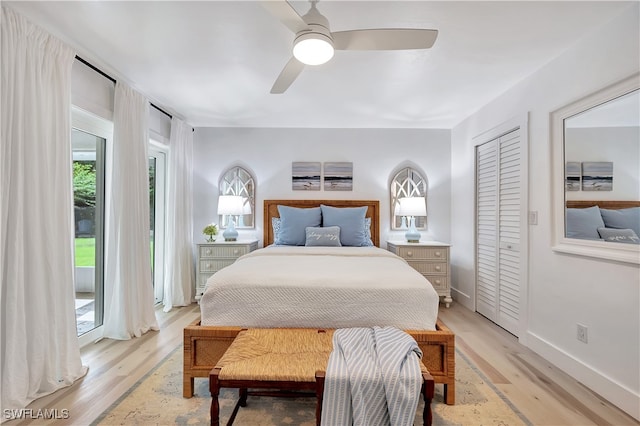 bedroom with a closet, access to exterior, light hardwood / wood-style floors, and ceiling fan