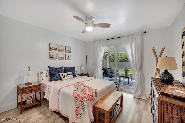 bedroom featuring access to exterior, light hardwood / wood-style floors, and ceiling fan