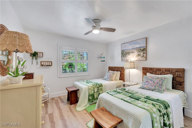 bedroom featuring light wood-type flooring and ceiling fan