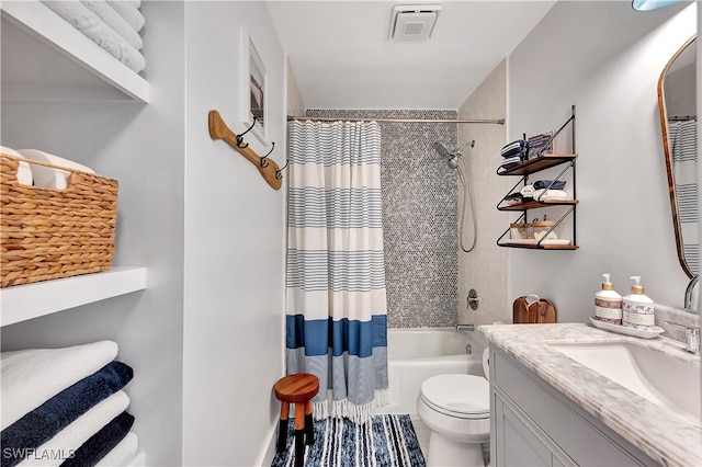 full bathroom featuring toilet, vanity, and shower / tub combo