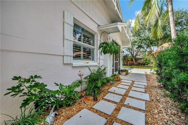 view of property exterior with a patio area