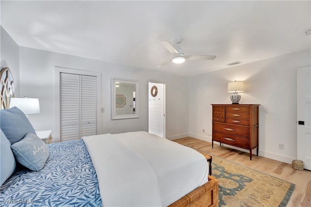 bedroom with a closet, ceiling fan, and light hardwood / wood-style floors