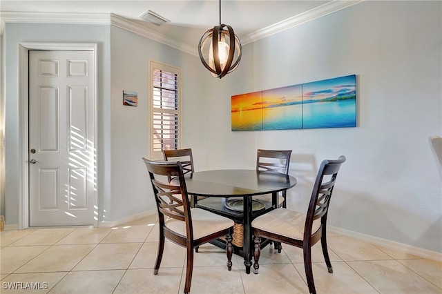 dining area with light tile patterned floors and crown molding