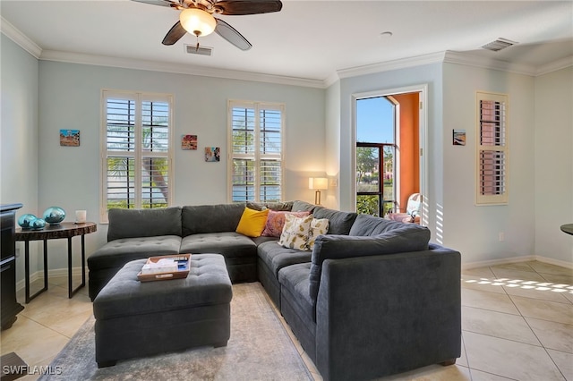 tiled living room featuring ceiling fan and crown molding