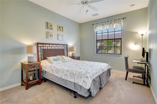 bedroom with ceiling fan and light colored carpet