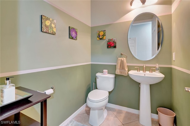 bathroom featuring toilet and tile patterned flooring