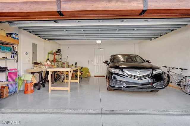 garage featuring a garage door opener and electric panel