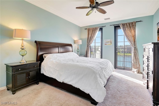 bedroom featuring ceiling fan, access to exterior, crown molding, and light colored carpet