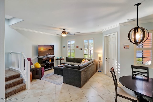 living room featuring light tile patterned flooring, ceiling fan, and ornamental molding